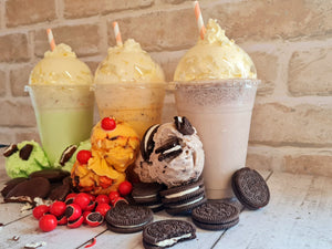 Three ice cream shakes topped with whipped cream, features Mint Slice, Jaffa Crunch and Oreo rolled ice cream decorates the shakes
